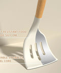 Close-up of spatula from 33 Piece Nonstick Silicone Kitchen Utensils Set With Holder Cream White Wooden Handles BPA Free.