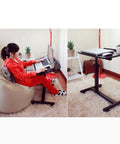 Smooth Operator Height Adjusting Overbed Table Rolling Desktop Stand Up Computer Workstation in home setting with laptop.