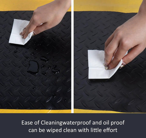 Anti Fatigue Floor Mat For Garage And Workshop Shop 20x60 Inch Ergonomic Standing Mat With Bright Safety Yellow Border Heavy Duty PVC Foam Cushion To Relieve Foot And Back Pain While You Work All Day being cleaned with paper towel, showing easy maintenance.