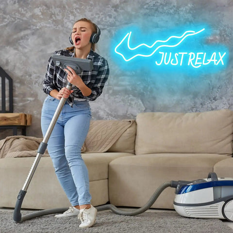 Woman vacuuming beneath Just Relax LED Neon Sign For Walls USB Powered Light Up Decor With On Off Switch Ideal For Party Office Kids Room Birthday Game Room Wedding Gift Great For Home Decor And Party Backdrops