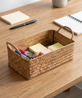 Spacious Open Top Seagrass Woven Storage Basket With Heavy Duty Handles For Kitchen Farmhouse Pantry Bathroom Towels Cosmetics And Hassle Free Daily Organization Goals holding office supplies on a wooden desk.