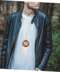 Person wearing Lightweight Hiking Compass With Map Ruler, Rugged Metal Pocket Navigation Tool For Outdoor Camping And Backpacking around neck.