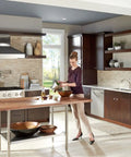 Modern kitchen with refillable kitchen soap dispenser with above sink bottle in spot resist stainless finish, deck mounted.