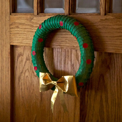 Wreath made from Green Duct Tape 1.88 In By 20 Yd Heavy Duty Colored Tape For Repairs And Crafts hanging on wooden door