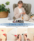 Person using Must Have Carry Along Portable Sewing Kit With Mixed Color Threads, Stainless Steel Scissors, Thimble, in living room.