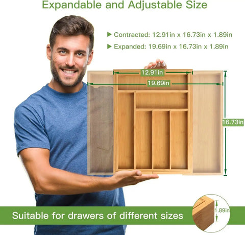 Person holding Expandable Bamboo Silverware Drawer Organizer With Adjustable Compartments in front, dimensions labeled, natural color