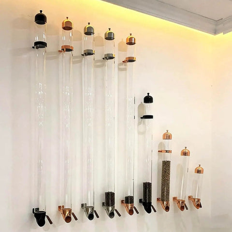 Ditch The Countertop Clutter And Keep Your Brew Game Strong With This Wall Mounted Coffee Bean Dispenser Featuring Adjustable Portion Control And Durable Borosilicate Glass Tube In Sleek Black, showing clear glass tubes secured on a wall.
