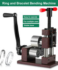 Pretty Dang Reliable Manual Ring And Bracelet Bending Machine With Rock Solid 2.2 Inch Steel Shaft and smooth hand crank visible with metal rings.