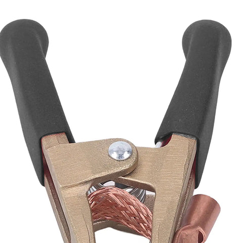 Heavy Duty Brass Welding Ground Clamp Rated For 500 Amps With Large 60mm Jaw Opening For Secure Earth Clip Hookups On Cars And Heavy Power Train Manufacturing Jobs You Can Count On Today, showing non-slip handle and copper wire.