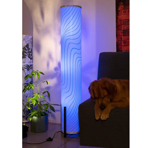 61 Inch Color Changing Floor Lamp With 3 Smart LED Bulbs illuminating blue light near a sofa and plant, creating cozy vibes