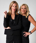 Life Is A Lazy Susan Of Straight Fire Advice And Keeping It Real Wisdom From The Beloved Podcast Duo For Crushing Burnout Laughing At Life Chaos And Staying Grounded. Image of two women in black outfits posing confidently.