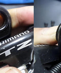 Close-up of durable steel Rear Derailleur Mounting Screws for Tx35 and Tz50, shown in use on mountain bike derailleur. Easy install.