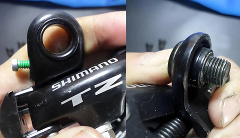 Close-up of durable steel Rear Derailleur Mounting Screws for Tx35 and Tz50, shown in use on mountain bike derailleur. Easy install.