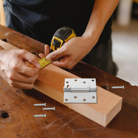 Craftsman measuring wood with Beefy Heavy Duty Stainless Steel Door Spring Hinge Self Closing on workbench