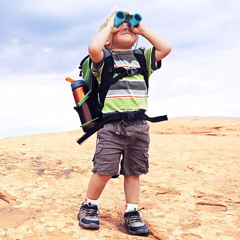 Boy using Kids Binoculars Set For Outdoor Explorers With 4x30 Optics, Carrying Bag, Neck Straps And Lens Cloth, Totally The Best Gift For Ages 3 To 12, Bird Watching, Hiking, Safari And Nature Study.