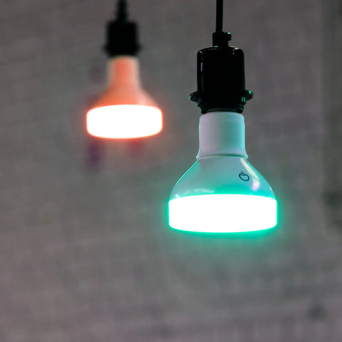 Hanging Crazy Bright Supercolor BR30 Smart Flood Bulbs 2 Pack RGB Plus Tunable White showing green and orange light