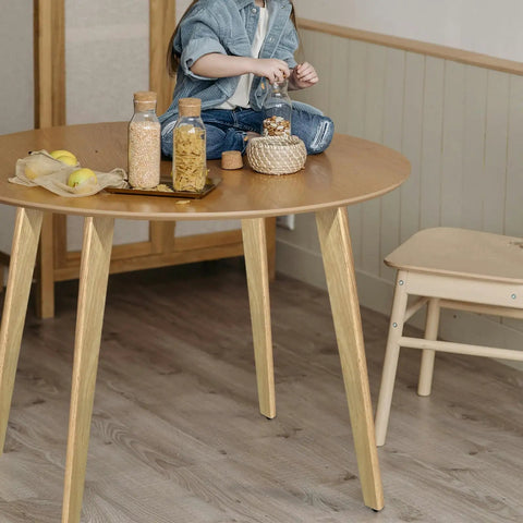 Premium Solid Wood Table Legs 28 Inches Tall Natural Finish Heavy Duty Dining Desk Supports slanted base with child on table.