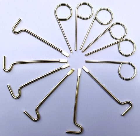 Top Shelf Emergency Key Kit For Interior Door Locks With Kwikset Schlage Includes Twelve Heavy Duty Brass Tools arranged in a circle.