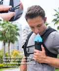 Man using Unisex Hands Free Running Hydration Vest with 500ml soft flask. Adjustable chest straps shown. Black camo design.