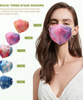 Woman wearing a purple and pink patterned mask from a multi-colored 50-pack of fashionable safety masks with ergonomic fit.