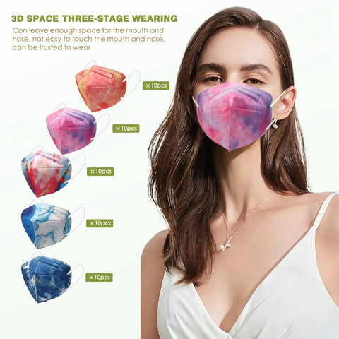 Woman wearing a purple and pink patterned mask from a multi-colored 50-pack of fashionable safety masks with ergonomic fit.