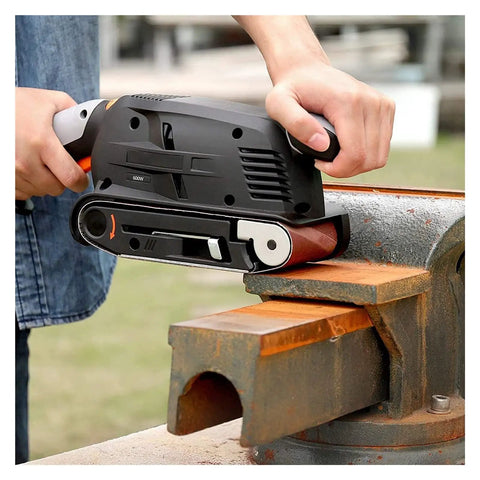 User operating 600 Watt Electric Belt Sander With Variable Speed Up To 560Rpm on a bench grinder for metal grinding.