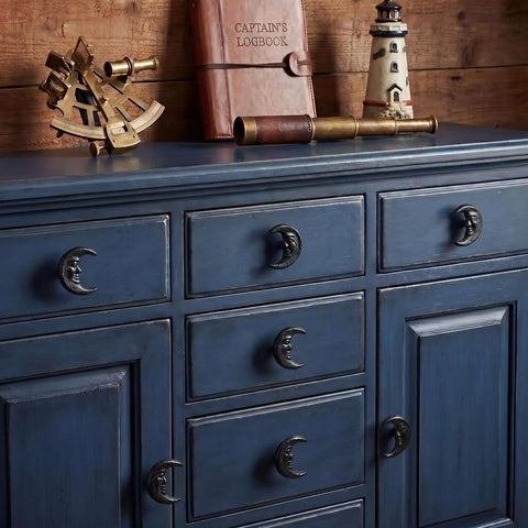 Six Piece Set Black Cast Iron Drawer Pulls And Cabinet Knobs With Crescent Moon Face Design Hand Painted In Rich Black Finish Adds Mid Century Modern Charm And Elegant Burst Style Includes Screws on blue dresser