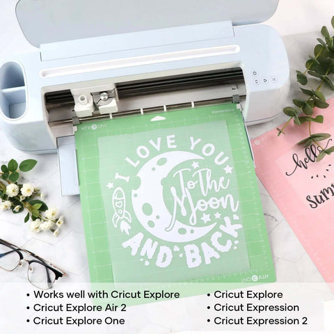 HTVRONT 2-pack 12x12 green cutting mats with white I love you to the moon and back design shown installed in a Cricut-style cutter