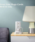 Tower Surge Protector Power Strip With 12 Outlets 4 USB Ports Including USB C 6.5 Foot Extension Cord 16 In 1 Charging Station on table