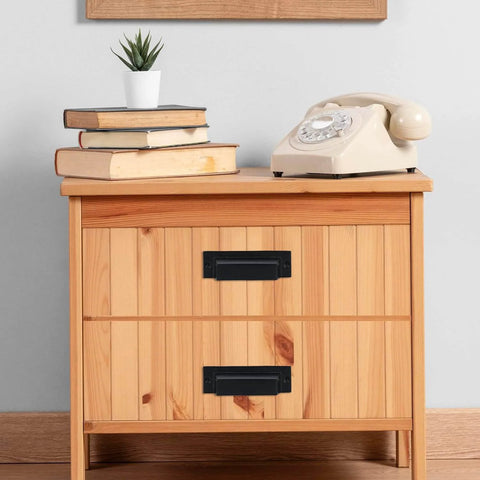 Wooden cabinet with set of 10 industrial cast iron drawer pulls in black, installed for vintage rustic kitchen hardware