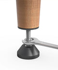 Close-up of Beefy Heavy Duty Furniture Levelers with Nut Kit adjustable feet being installed on a wood leg with a wrench.