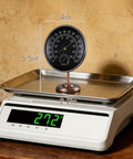 Vintage Brass Indoor Outdoor Thermometer And Humidity Gauge 2 In 1 Weather Station With Removable Stand on weighing scale