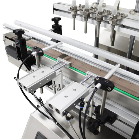 Close-up of Desktop four head magnetic pump on Automatic Liquid Filling And Bottle Capping Sealer Machine.