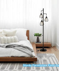 Industrial Tree Floor Lamp With Three Teardrop Cage Heads And ST58 Edison LED Bulbs, tall vintage pole light in bedroom setting.