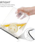 Hand holding airtight food storage container with lemons and a silicone ring, 7 piece BPA free kitchen canisters for pantry organization.