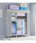 Rock Solid Portable Clothes Wardrobe And Roomy Storage Closet Organizer With Foldable Fabric Cover Heavy Duty Steel Frame No Sweat Setup in a bright room storing clothes and luggage.