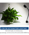 Beast Mode Bright 500 Lumens LED Magnetic Work Light with 11.8 Inch Flexible Gooseneck next to a potted plant.