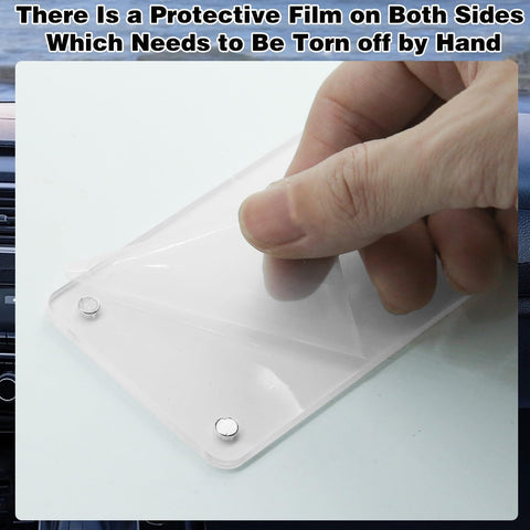 Hand peeling film from Two Pack Acrylic Magnetic Car Photo Holder Visor Clip Set Must Have Personalized Picture Frame.