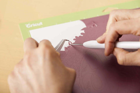 Cricut Basic Tool Set, 5-piece precision kit; white-handled tools on a pink cutting mat