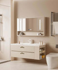 Modern bathroom with beige floating vanity, mirror, and white fixtures, showcasing details of the space.