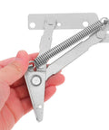 Hand holding heavy duty 80 degree spring hinge for cabinets and sofas, cold rolled steel door support hinge, silver color