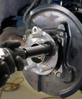 Pro Grade Wheel Hub Resurfacing Kit With Metal Housing And Brake Surface Cleaner For Studs in use on wheel hub
