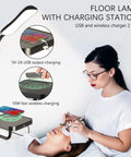 Smart LED Floor Lamp With Wireless Charger, 12W Dimmable Standing Lamp next to a woman using wireless charging feature