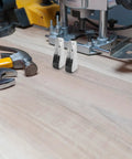 Killer Durability Heavy Duty Sliding Door Track Pulley Roller Set with Zero Friction Silent Glides on a workbench with tools.