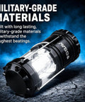 Bright LED Camping Lantern For Power Outages And Hurricane Prep, showing durable black collapsible design, on rugged surface.