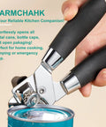 Multifunctional Stainless Steel Can Opener And Bottle Opener With Easy Turn Knob Heavy Duty Handheld Kitchen Tool For Seniors By Yarmchahk Smooth Edge And Sharp Blade Non Slip Grips Black, shown opening a can.