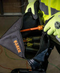 Person holding Cordura Nylon Tool Pouch with Heavy Duty Zipper, 12-1/2 Inch Black Zipper Bag for screwdrivers and wrenches.