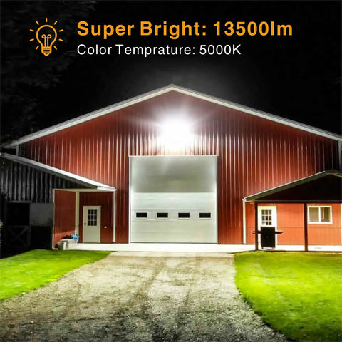 LED Outdoor Flood Light 150W 13500Lm illuminating a large barn with 330 degree coverage at night