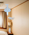 Ultra Thin Magnetic Cruise Fan That Locks Onto Walls Or Ceilings Solid Grip Portable Rechargeable Cooling Buddy mounted in a cruise stateroom.