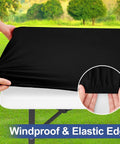 Hands stretching black Super Stretch Spandex Tablecloth For 6 Foot Tables Fitted Elastic Cover That Stays Put Washable Outdoor Patio Cloth For Camping And Parties 30 X 72 Inches